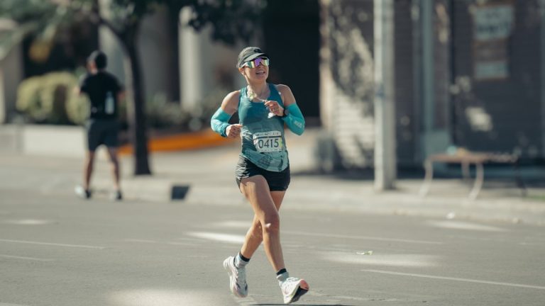 Woman running a race on a sunny day